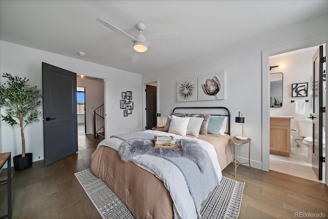 bedroom with ceiling fan, baseboards, and wood finished floors