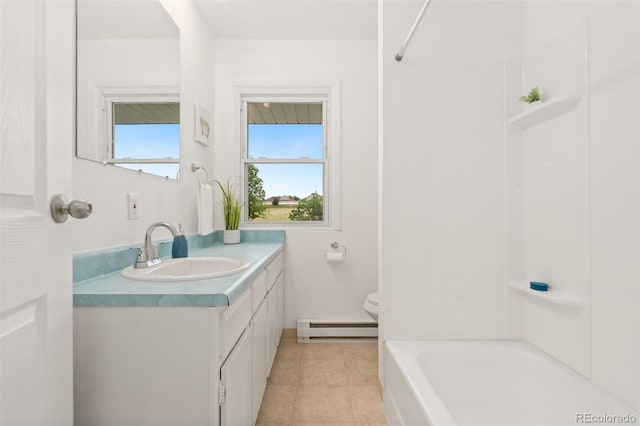 14475 Lanewood St, Brighton, CO 80603 - full bath with a baseboard heating unit, vanity, tile patterned floors, and shower / washtub combination