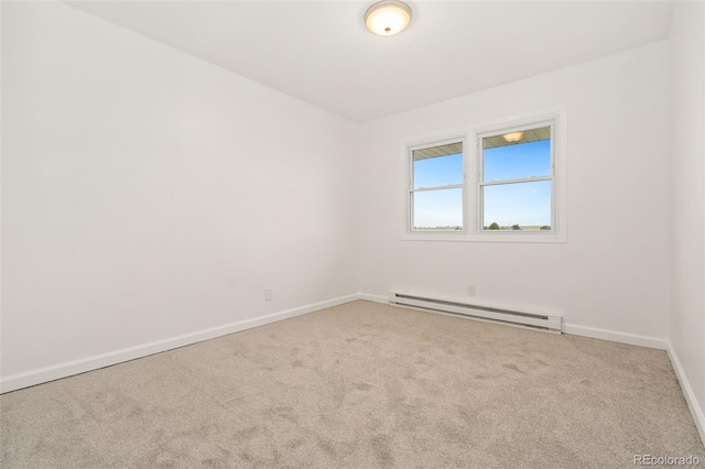 14475 Lanewood St, Brighton, CO 80603 - empty room featuring a baseboard heating unit and carpet flooring
