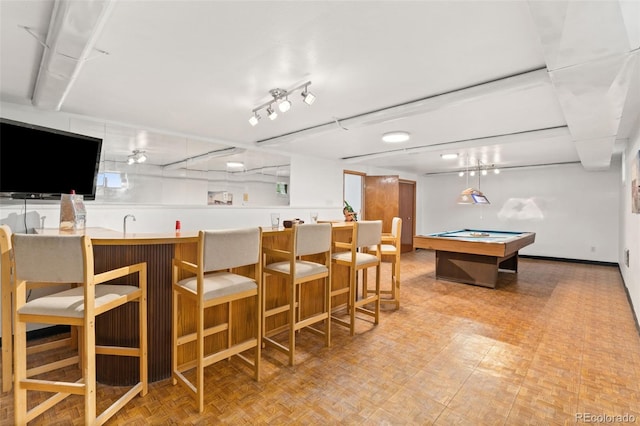 14475 Lanewood St, Brighton, CO 80603 - indoor wet bar featuring billiards table and baseboards
