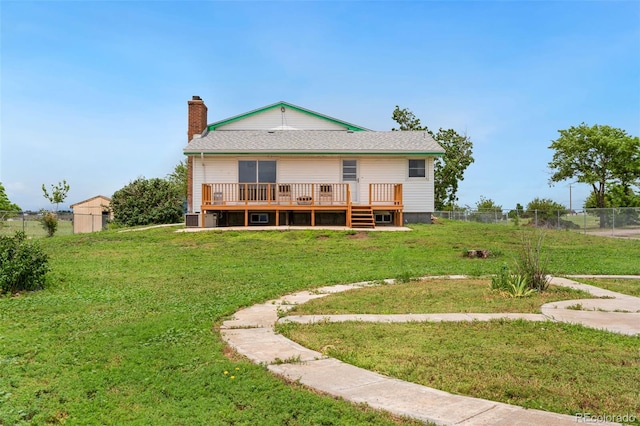 14475 Lanewood St, Brighton, CO 80603 - back of property featuring a deck, a chimney, and roof with shingles