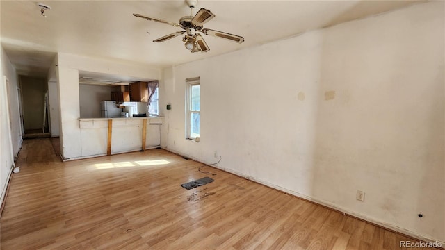 interior space featuring light wood-type flooring and ceiling fan