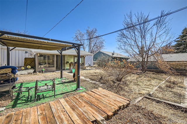 view of yard featuring a sunroom