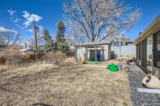 view of yard with an outbuilding and fence