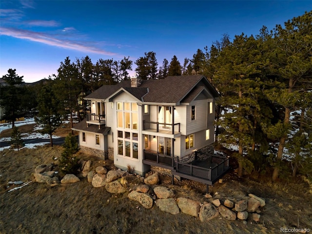 view of front of home with a balcony