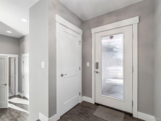 foyer entrance with dark wood-type flooring