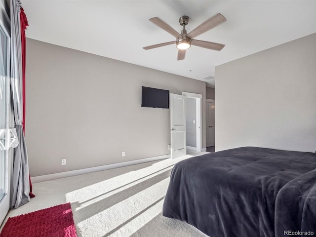 bedroom featuring light colored carpet and ceiling fan