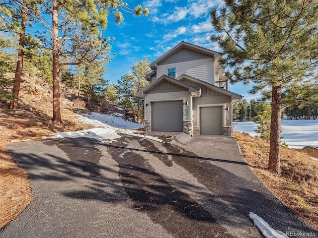 view of side of home featuring a garage