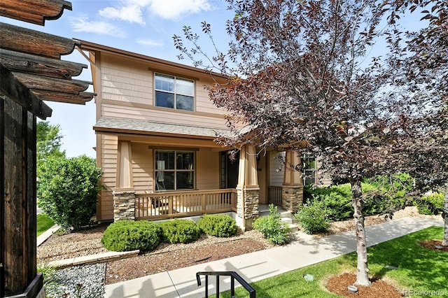 10368 Bluffmont Dr, Lone Tree, CO 80124 - view of front of house featuring covered porch and stone siding