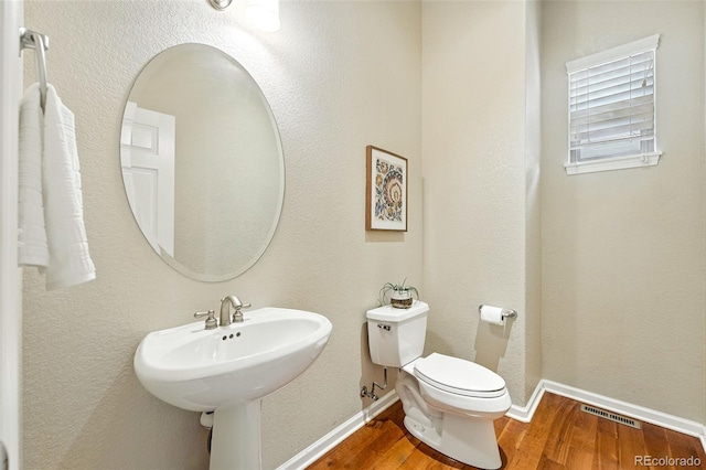 10368 Bluffmont Dr, Lone Tree, CO 80124 - half bath featuring wood finished floors