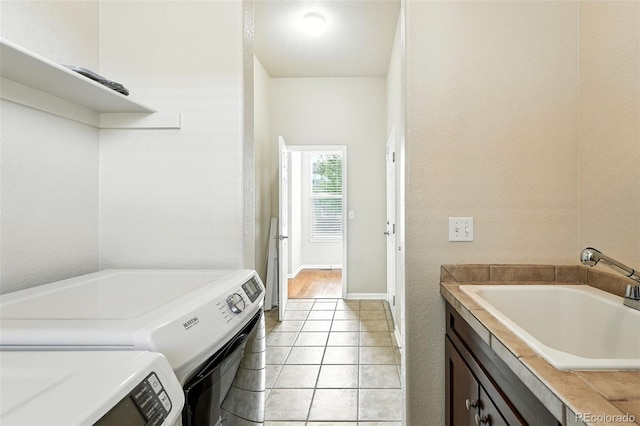 10368 Bluffmont Dr, Lone Tree, CO 80124 - washroom featuring washing machine and clothes dryer and light tile patterned floors