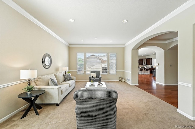 10368 Bluffmont Dr, Lone Tree, CO 80124 - carpeted living room with arched walkways, crown molding, and recessed lighting