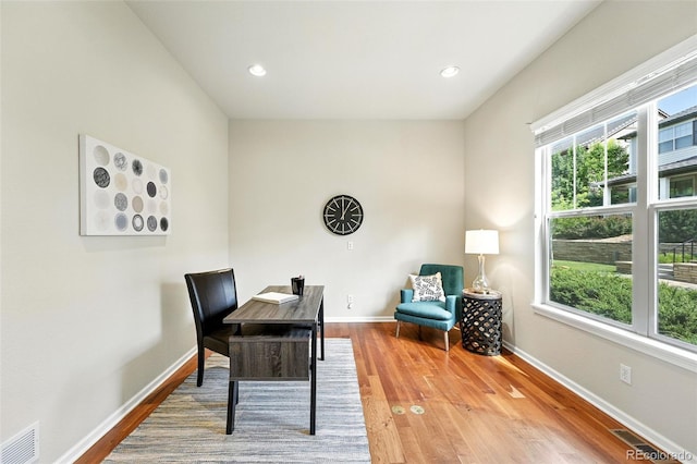 10368 Bluffmont Dr, Lone Tree, CO 80124 - home office featuring wood finished floors and recessed lighting