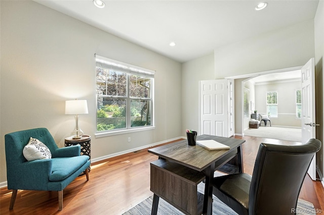 10368 Bluffmont Dr, Lone Tree, CO 80124 - home office featuring plenty of natural light, wood finished floors, recessed lighting, and arched walkways