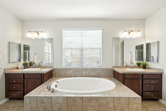 10368 Bluffmont Dr, Lone Tree, CO 80124 - bathroom featuring a shower stall, a garden tub, two vanities, and tile patterned flooring
