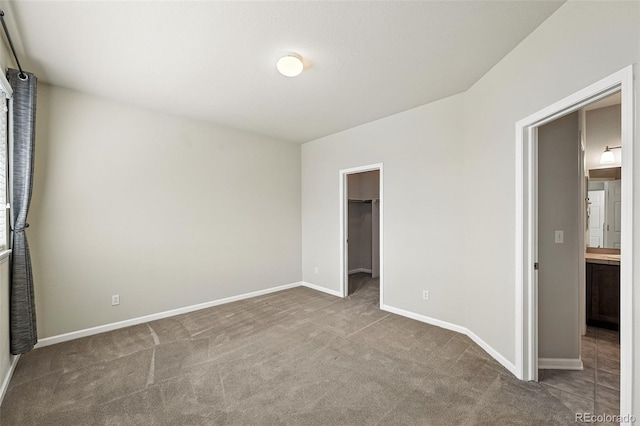 10368 Bluffmont Dr, Lone Tree, CO 80124 - unfurnished bedroom featuring carpet and a spacious closet