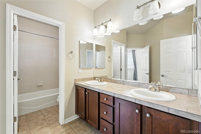 10368 Bluffmont Dr, Lone Tree, CO 80124 - bathroom with double vanity, tile patterned flooring, and shower / tub combination