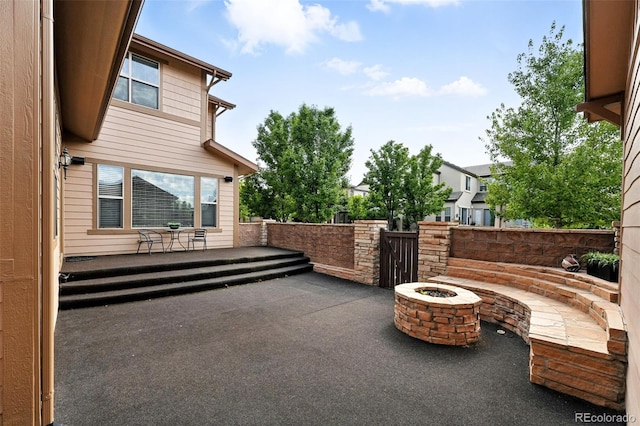 10368 Bluffmont Dr, Lone Tree, CO 80124 - view of patio / terrace with an outdoor fire pit