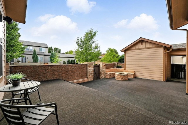 10368 Bluffmont Dr, Lone Tree, CO 80124 - view of patio / terrace featuring a gate and an outdoor fire pit