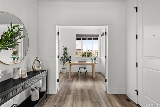 11187 W 53rd Dr, Wheat Ridge, CO 80033 - corridor with wood finished floors and a desk