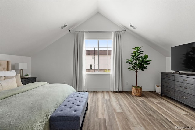 11187 W 53rd Dr, Wheat Ridge, CO 80033 - bedroom featuring light wood-type flooring and lofted ceiling