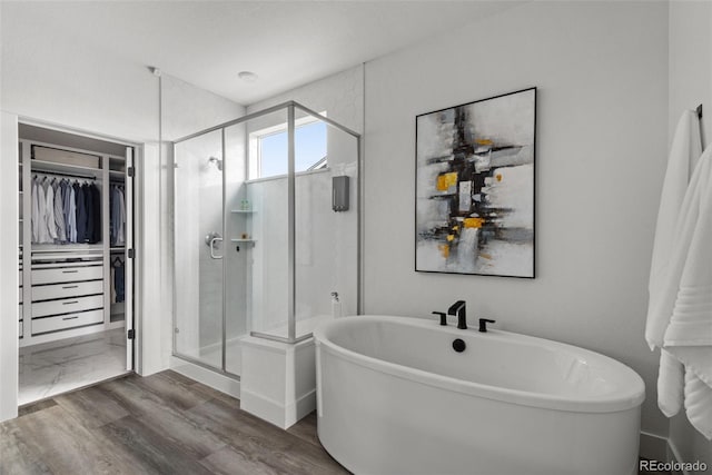 11187 W 53rd Dr, Wheat Ridge, CO 80033 - full bathroom with a spacious closet, a shower stall, and a freestanding tub