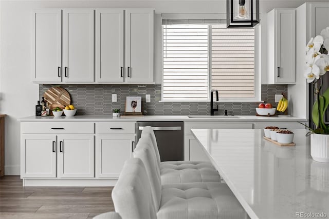 11187 W 53rd Dr, Wheat Ridge, CO 80033 - kitchen featuring stainless steel dishwasher and white cabinets