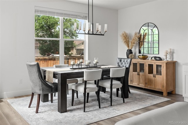 11187 W 53rd Dr, Wheat Ridge, CO 80033 - dining room with a chandelier and wood finished floors
