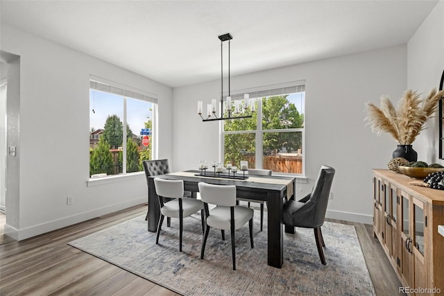 11187 W 53rd Dr, Wheat Ridge, CO 80033 - dining room featuring a chandelier and wood finished floors
