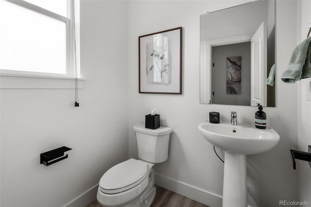 11187 W 53rd Dr, Wheat Ridge, CO 80033 - half bathroom featuring toilet and wood finished floors