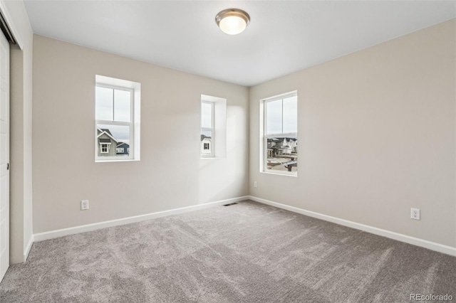 view of carpeted spare room