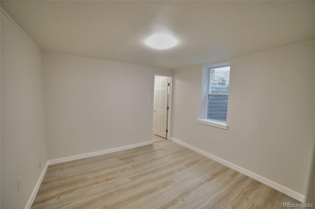 spare room featuring light hardwood / wood-style flooring