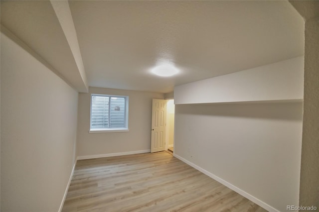 basement featuring light hardwood / wood-style floors