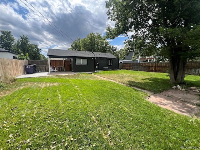 view of yard with a patio and central air condition unit