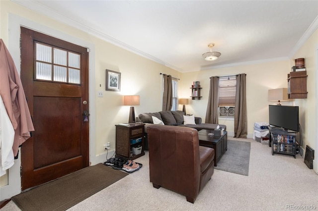 living area featuring light colored carpet and crown molding
