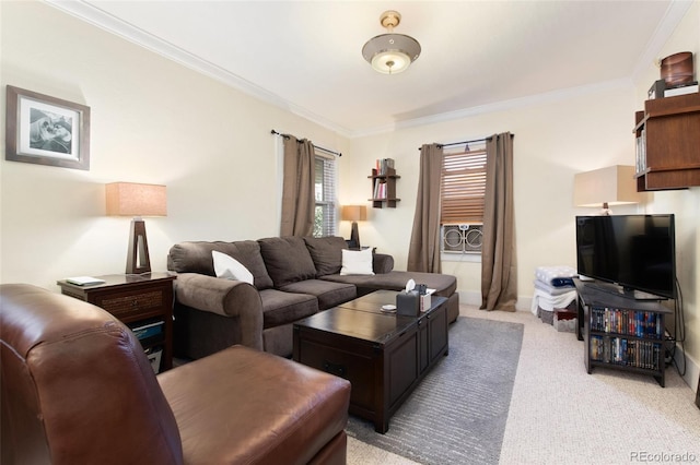 living area with ornamental molding, light carpet, and baseboards