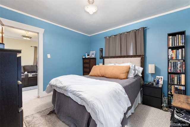 carpeted bedroom featuring crown molding