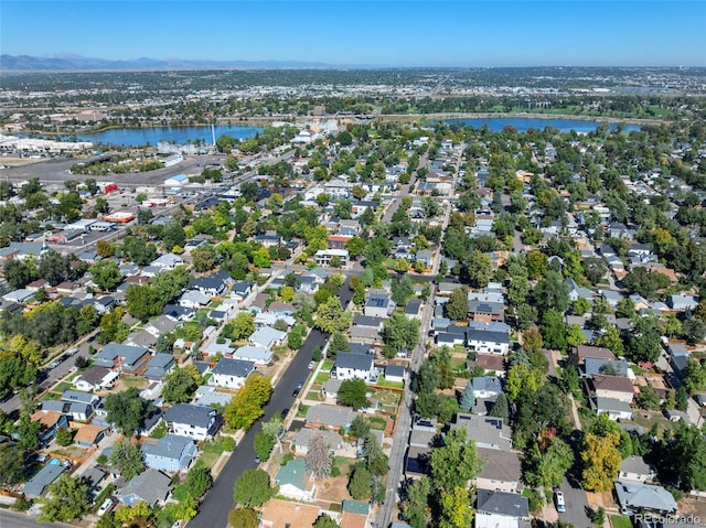 aerial overview of property's location with a large body of water and nearby suburban area