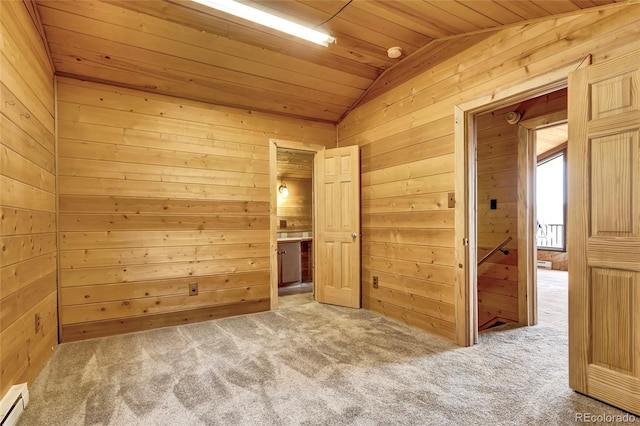 unfurnished bedroom featuring wood ceiling, lofted ceiling, light colored carpet, wooden walls, and baseboard heating