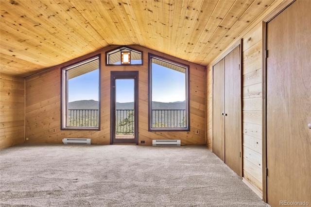 bonus room with wood ceiling, wood walls, and vaulted ceiling