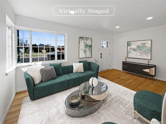 living room featuring light hardwood / wood-style floors and plenty of natural light