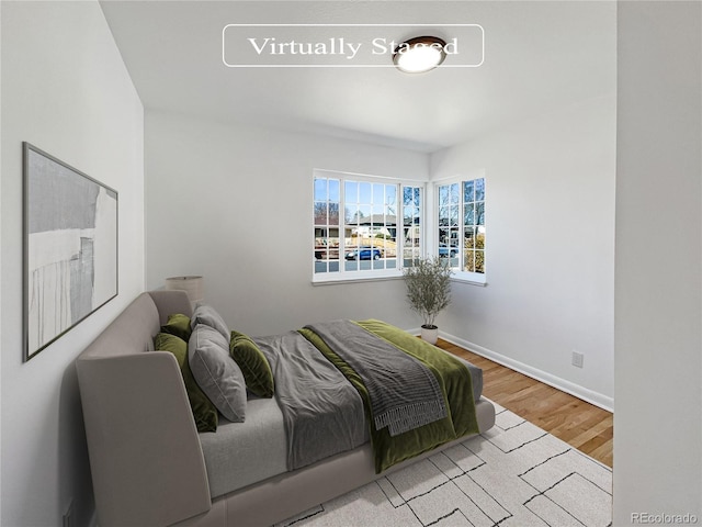 bedroom with light wood-type flooring