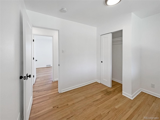 interior space featuring a closet and light hardwood / wood-style floors