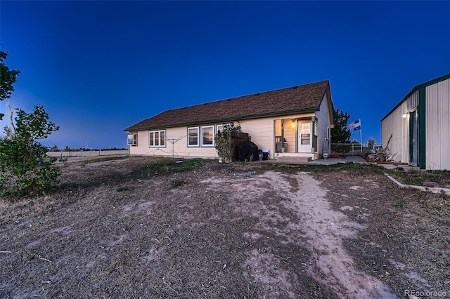 rear view of property featuring a patio area