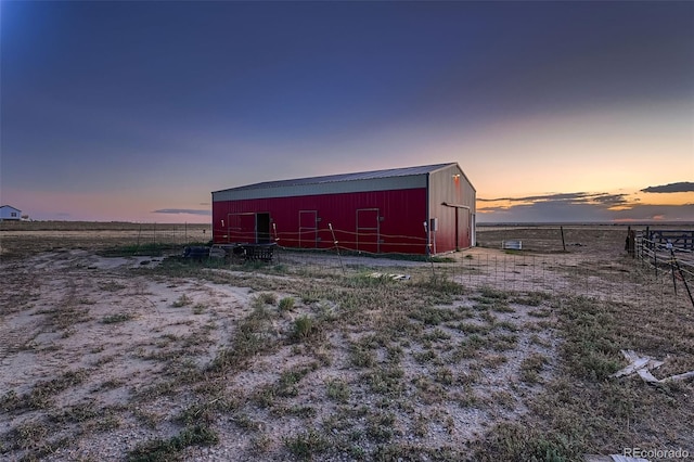 outdoor structure at dusk with a rural view