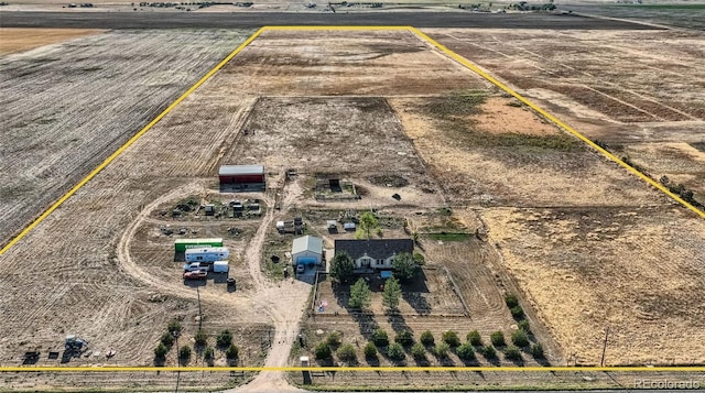 birds eye view of property featuring a rural view