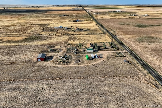 birds eye view of property featuring a rural view