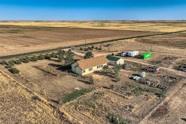 birds eye view of property with a rural view