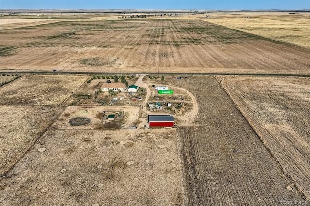 birds eye view of property featuring a rural view