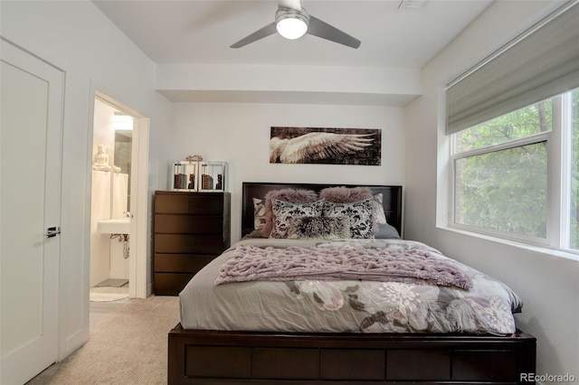 3030 Wilson Ct Unit 5, Denver, CO 80205 - bedroom with light colored carpet, connected bathroom, and a ceiling fan